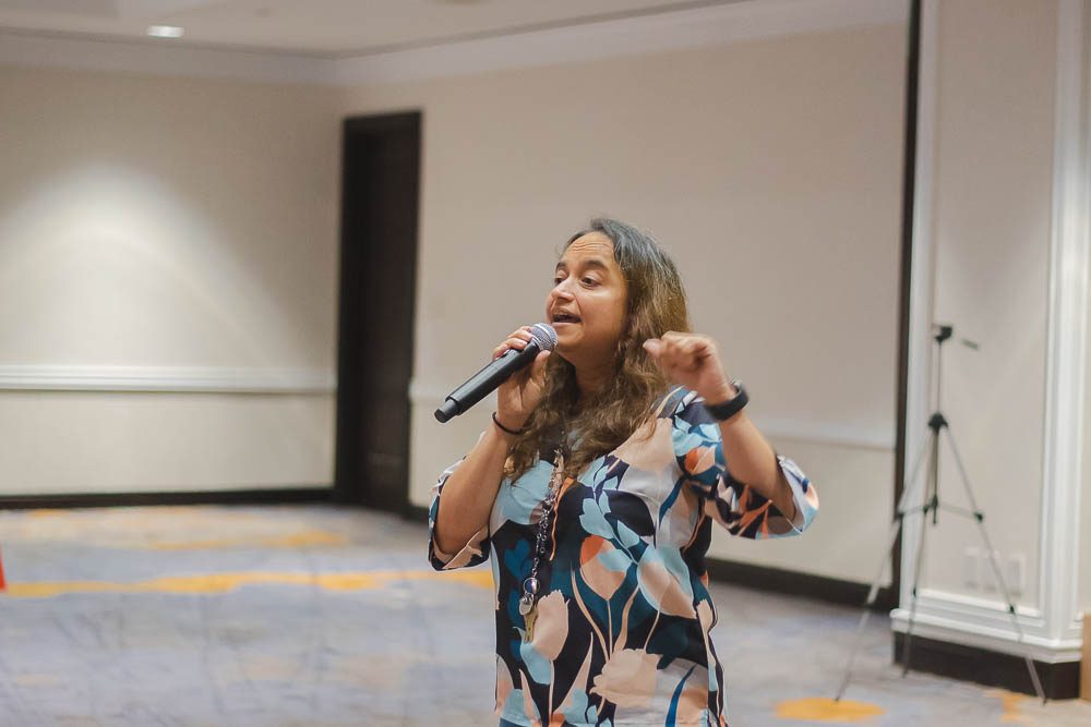 A woman singing into a microphone