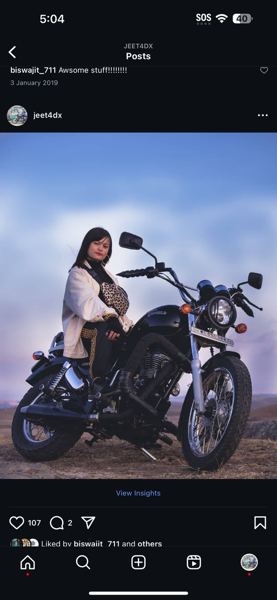 Instagram post of a woman with a motorcycle